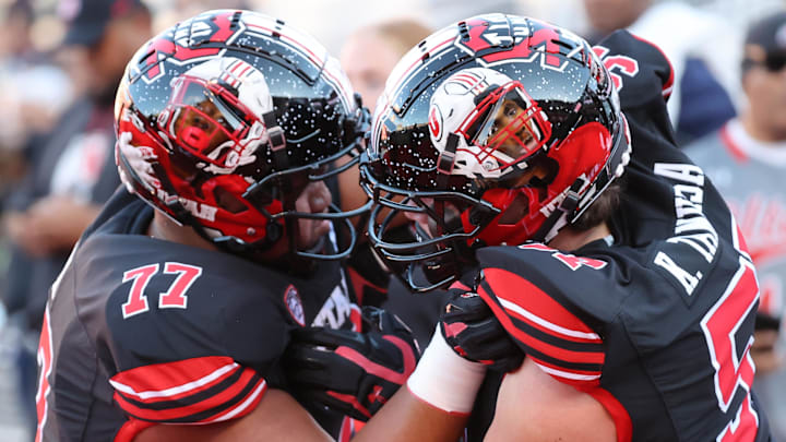 Utah defensive tackle Simote Pepa (77) and linebacker Andrew Mata'afa (55) show off their hand-painted helmets. Utah defensive tackle Simote Pepa (77) and linebacker Andrew Mata'afa (55) show off their hand-painted helmets.