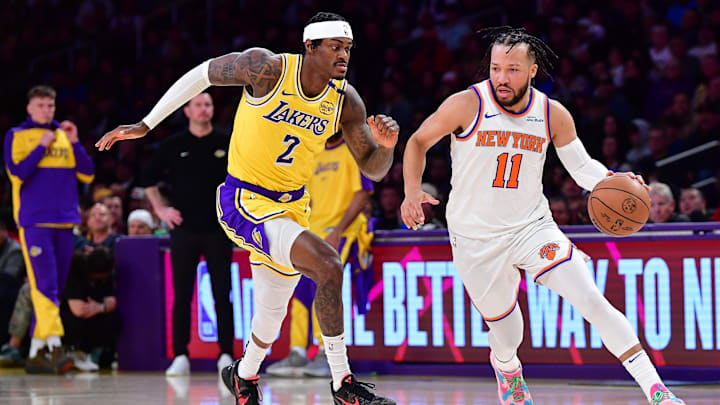 Mar 6, 2025; Los Angeles, California, USA; New York Knicks guard Jalen Brunson (11) moves the ball against Los Angeles Lakers forward Jarred Vanderbilt (2) during the first half at Crypto.com Arena. Mandatory Credit: Gary A. Vasquez-Imagn Images
