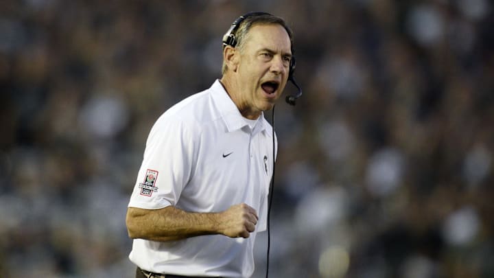 Jan 1, 2014; Pasadena, CA, USA; Michigan State Spartans head coach Mark Dantonio celebrates after Michigan State Spartans wide receiver Tony Lippett (not pictured) scored a touchdown against the Stanford Cardinal during the second half at the Rose Bowl. Mandatory Credit: Robert Hanashiro-Imagn Images