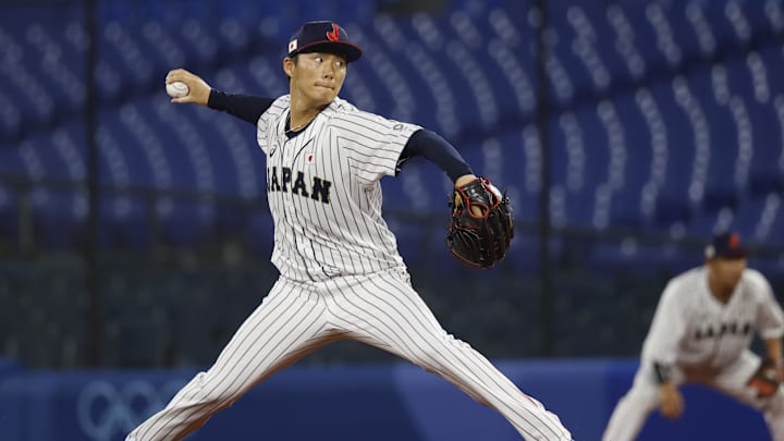 Aug 4, 2021; Yokohama, Japan; Team Japan pitcher Yoshinobu Yamamoto (17) throws a pitch against