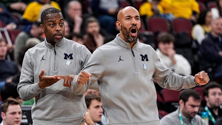 Michigan assistant coaches Mike Boynton Jr., left, and Justin Joyner react to a play against Ohio State during the first half of Big Ten tournament quarterfinal at United Center in Chicago on Friday, March 13, 2026.
