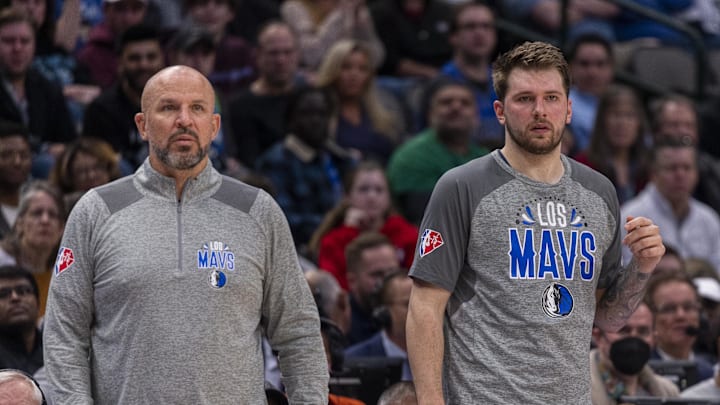 Mar 7, 2022; Dallas, Texas, USA; Dallas Mavericks head coach Jason Kidd and guard Luka Doncic (77) watch the action between the Dallas Mavericks and the Utah Jazz at the American Airlines Center. Mandatory Credit: Jerome Miron-Imagn Images