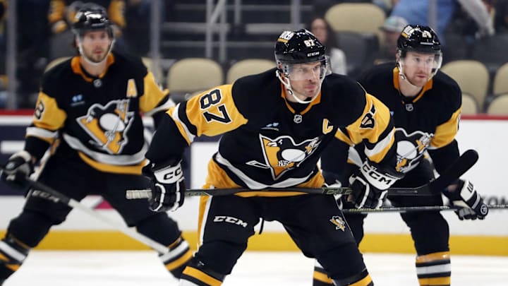 Oct 4, 2024; Pittsburgh, Pennsylvania, USA;  Pittsburgh Penguins center Sidney Crosby (87) prepares for the opening face-off against the Columbus Blue Jackets during the first period at PPG Paints Arena. Mandatory Credit: Charles LeClaire-Imagn Images