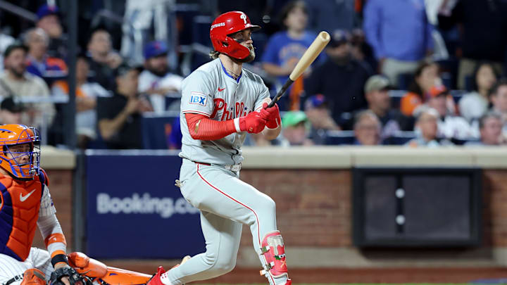 Oct 8, 2024; New York City, New York, USA; Philadelphia Phillies first baseman Bryce Harper (3) hits an RBI single in the eighth inning against the New York Mets during game three of the NLDS for the 2024 MLB Playoffs at Citi Field. Oct 8, 2024; New York City, New York, USA; Philadelphia Phillies first baseman Bryce Harper (3) hits an RBI single in the eighth inning against the New York Mets during game three of the NLDS for the 2024 MLB Playoffs at Citi Field.