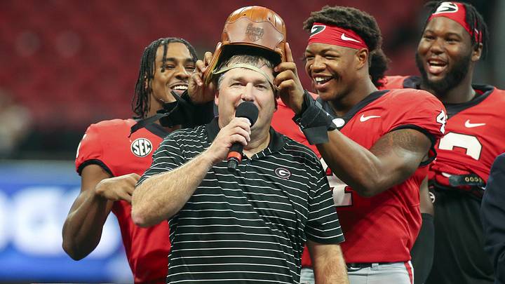 Sep 3, 2022; Atlanta, Georgia, USA; Georgia Bulldogs linebacker Nolan Smith (4) puts the Old Leather Helmet on head coach Kirby Smart after a victory against the Oregon Ducks at Mercedes-Benz Stadium. Mandatory Credit: Brett Davis-Imagn Images
