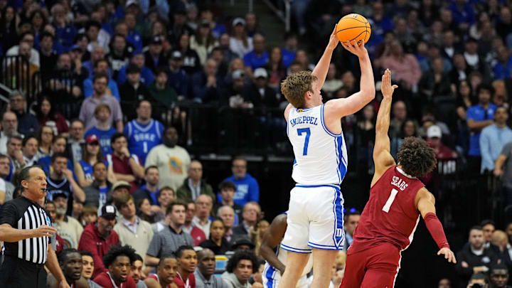 Mar 29, 2025; Newark, NJ, USA; Duke Blue Devils guard Kon Knueppel (7) shoots the ball against Alabama Crimson Tide guard Mark Sears (1) during the first half.