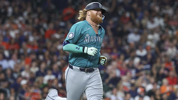 Seattle Mariners designated hitter Justin Turner runs after hitting a single against the Houston Astros on Sept. 23 at Minute Maid Park.