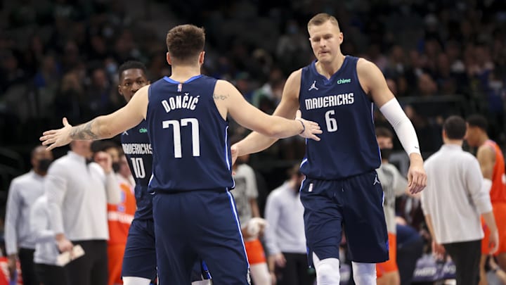 Jan 17, 2022; Dallas, Texas, USA;  Dallas Mavericks guard Luka Doncic (77) celebrates with center Kristaps Porzingis (6) during the second half against the Oklahoma City Thunder at American Airlines Center. Mandatory Credit: Kevin Jairaj-USA TODAY Sports