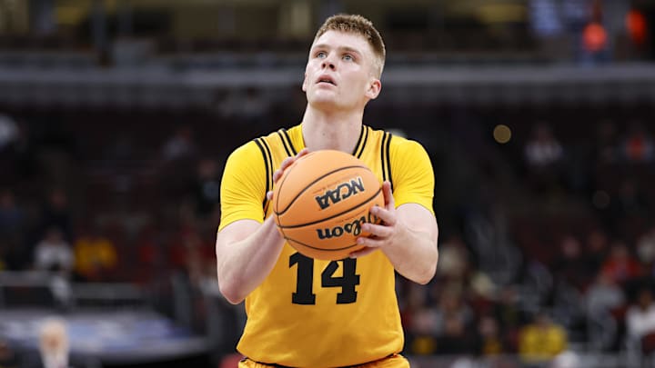 Mar 11, 2026; Chicago, IL, USA; Iowa Hawkeyes guard Bennett Stirtz (14) shoots a free throw against the Maryland Terrapins during the second half at United Center. Mandatory Credit: Kamil Krzaczynski-Imagn Images