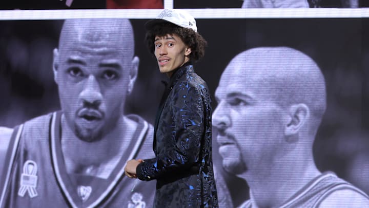 Jun 25, 2025; Brooklyn, NY, USA; Nolan Traore reacts after being selected as the 19th pick by the Brooklyn Nets in the first round of the 2025 NBA Draft at Barclays Center. Mandatory Credit: Brad Penner-Imagn Images Jun 25, 2025; Brooklyn, NY, USA; Nolan Traore reacts after being selected as the 19th pick by the Brooklyn Nets in the first round of the 2025 NBA Draft at Barclays Center. Mandatory Credit: Brad Penner-Imagn Images