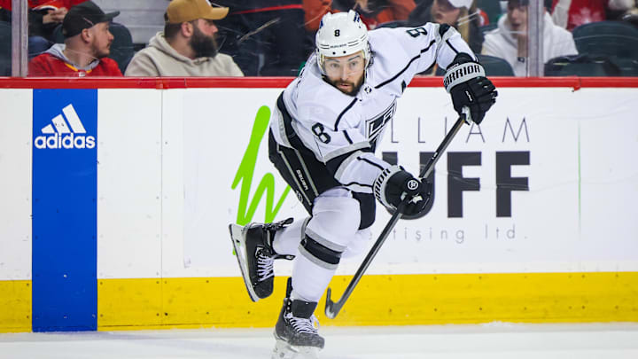 Mar 30, 2024; Calgary, Alberta, CAN; Los Angeles Kings defenseman Drew Doughty (8) passes the puck against the Calgary Flames during the third period at Scotiabank Saddledome. Mandatory Credit: Sergei Belski-Imagn Images