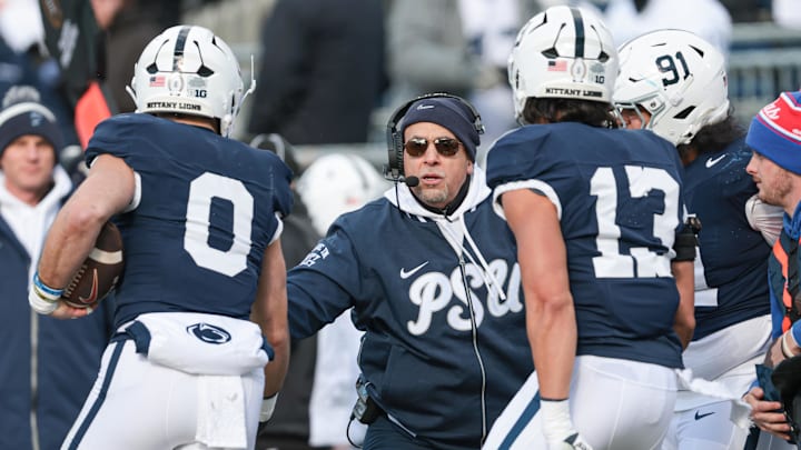 Penn State Nittany Lions head coach James Franklin celebrates with linebacker Dominic DeLuca (0)