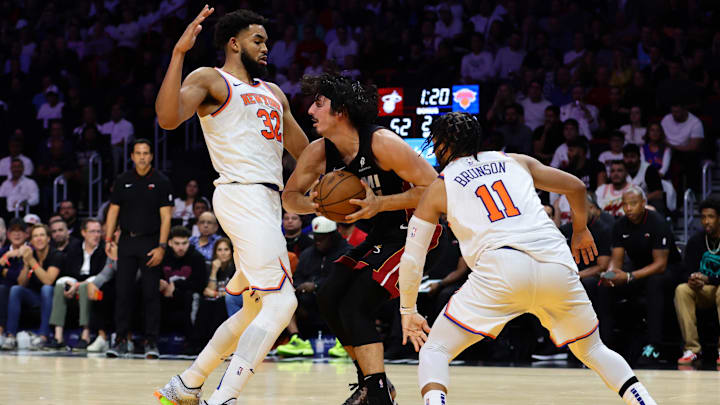 Oct 30, 2024; Miami, Florida, USA; Miami Heat guard Jaime Jaquez Jr. (11) protects the basketball against New York Knicks center Karl-Anthony Towns (32) during the second quarter at Kaseya Center. Mandatory Credit: Sam Navarro-Imagn Images Oct 30, 2024; Miami, Florida, USA; Miami Heat guard Jaime Jaquez Jr. (11) protects the basketball against New York Knicks center Karl-Anthony Towns (32) during the second quarter at Kaseya Center. Mandatory Credit: Sam Navarro-Imagn Images