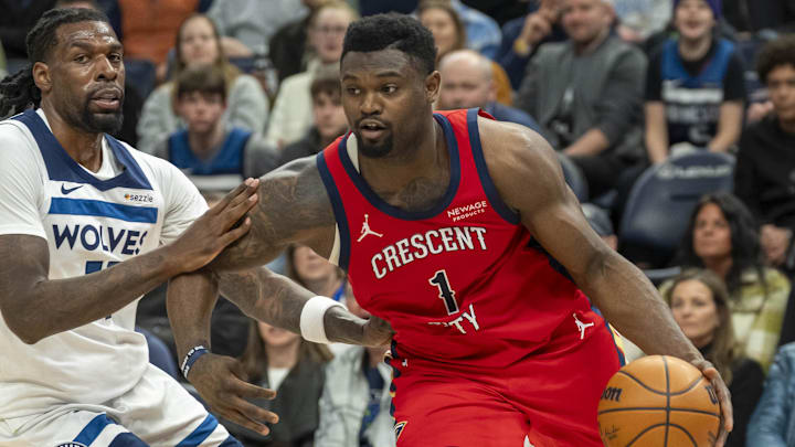 Mar 19, 2025; Minneapolis, Minnesota, USA; New Orleans Pelicans forward Zion Williamson (1) drives to the basket past Minnesota Timberwolves center Naz Reid (11) in the second half at Target Center. Mandatory Credit: Jesse Johnson-Imagn Images