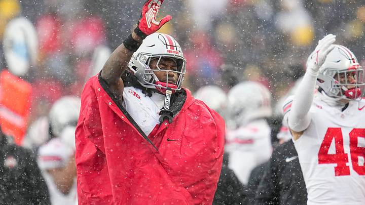 Ohio State Buckeyes wide receiver Jeremiah Smith (4) waves as Michigan Wolverines fans stream out of the gates in the fourth quarter of the NCAA football game at Michigan Stadium in Ann Arbor, Mich. on Nov. 29, 2025. Ohio State won 27-9. Ohio State Buckeyes wide receiver Jeremiah Smith (4) waves as Michigan Wolverines fans stream out of the gates in the fourth quarter of the NCAA football game at Michigan Stadium in Ann Arbor, Mich. on Nov. 29, 2025. Ohio State won 27-9.