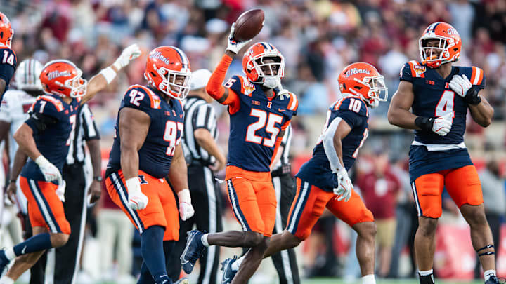 Dec 31, 2024; Orlando, FL, USA; Illinois Fighting Illini defensive back Jaheim Clarke (25) celebrates his fumble recovery against the South Carolina Gamecocks in the third quarter at Camping World Stadium. Mandatory Credit: Jeremy Reper-Imagn Images