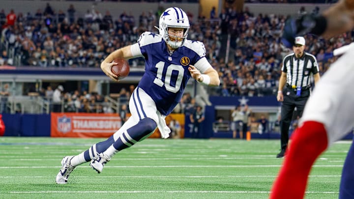 Nov 28, 2024; Arlington, Texas, USA; Dallas Cowboys quarterback Cooper Rush (10) runs for the end-zone during the second quarter against the New York Giants at AT&T Stadium. Mandatory Credit: Andrew Dieb-Imagn Images