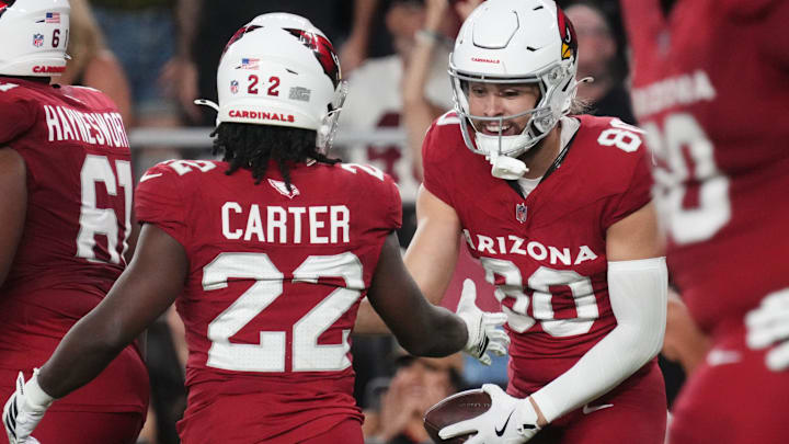 Arizona Cardinals receiver Simi Fehoko (80) celebrates his touchdown catch with teammate Michael Carter (22) as they play against the Las Vegas Raiders at State Farm Stadium in Glendale, on Aug. 23, 2025.