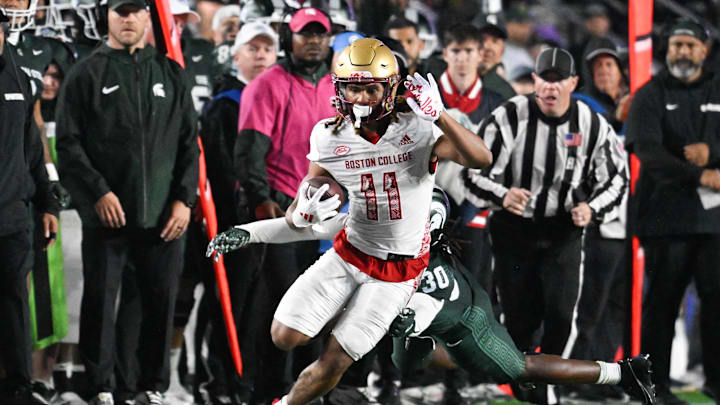 Sep 21, 2024; Chestnut Hill, Massachusetts, USA; Boston College Eagles wide receiver Lewis Bond (11) runs the ball against the Michigan State Spartans during the second half at Alumni Stadium. Mandatory Credit: Eric Canha-Imagn Images