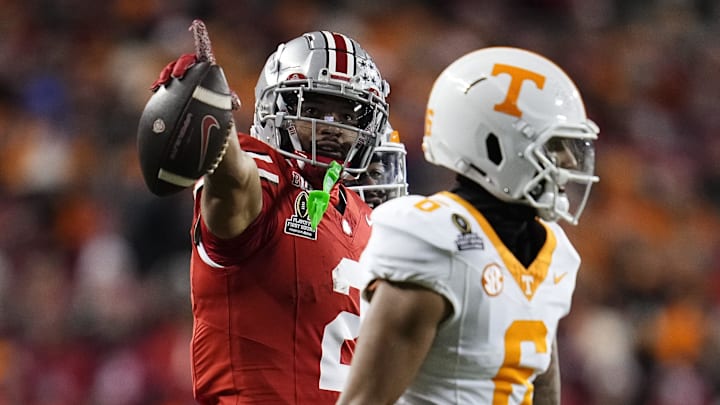 Ohio State Buckeyes wide receiver Emeka Egbuka (2) celebrates a first down catch behind Tennessee Volunteers defensive back Jalen McMurray (6) during the first half of the College Football Playoff first round game at Ohio Stadium in Columbus on Dec. 21, 2024.