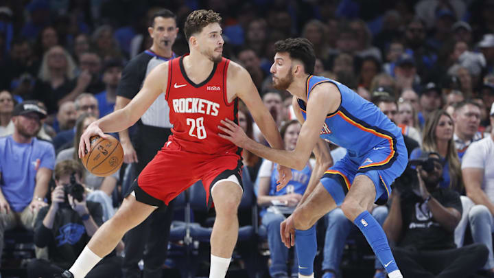 Oct 21, 2025; Oklahoma City, Oklahoma, USA; Houston Rockets center Alperen Sengun (28) drives to the basket against Oklahoma City Thunder center Chet Holmgren (7) during the first half at Paycom Center. Mandatory Credit: Alonzo Adams-Imagn Images Oct 21, 2025; Oklahoma City, Oklahoma, USA; Houston Rockets center Alperen Sengun (28) drives to the basket against Oklahoma City Thunder center Chet Holmgren (7) during the first half at Paycom Center. Mandatory Credit: Alonzo Adams-Imagn Images