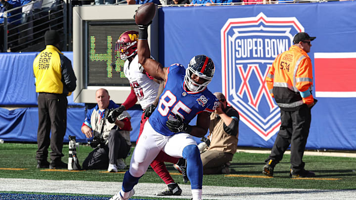 Nov 3, 2024; East Rutherford, New Jersey, USA; New York Giants tight end Chris Manhertz (85) celebrates after catching a touchdown  pass against the Washington Commander during the first half at MetLife Stadium.  