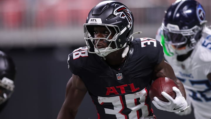 Aug 15, 2025; Atlanta, Georgia, USA; Atlanta Falcons running back Nathan Carter (38) runs the ball against the Tennessee Titans in the first quarter at Mercedes-Benz Stadium. Mandatory Credit: Brett Davis-Imagn Images