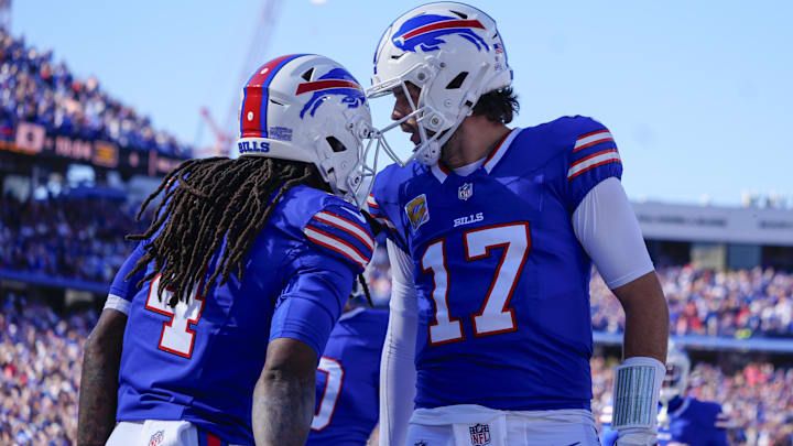 Buffalo Bills quarterback Josh Allen (17) and running back James Cook (4).