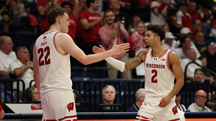Nov 27, 2025; San Diego, CA, USA; Wisconsin Badgers guard Nick Boyd (2) reacts with Wisconsin Badgers forward Austin Rapp (22) after scoring against the Providence Friars during the second half at Jenny Craig Pavilion. Mandatory Credit: Abe Arredondo-Imagn Images Nov 27, 2025; San Diego, CA, USA; Wisconsin Badgers guard Nick Boyd (2) reacts with Wisconsin Badgers forward Austin Rapp (22) after scoring against the Providence Friars during the second half at Jenny Craig Pavilion. Mandatory Credit: Abe Arredondo-Imagn Images