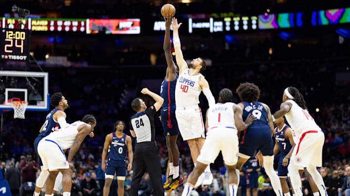 Mar 27, 2024; Philadelphia, Pennsylvania, USA; LA Clippers center Ivica Zubac (40) and Philadelphia 76ers center Mo Bamba (5) tip off to start the first quarter at Wells Fargo Center. Mandatory Credit: Bill Streicher-Imagn Images