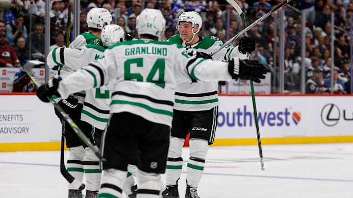 Apr 23, 2025; Denver, Colorado, USA; Dallas Stars left wing Jamie Benn (14) celebrates his goal with left wing Mason Marchment (27) and defenseman Thomas Harley (55) and center Mikael Granlund (64) in the third period against the Colorado Avalanche in game three of the first round of the 2025 Stanley Cup Playoffs at Ball Arena. Mandatory Credit: Isaiah J. Downing-Imagn Images