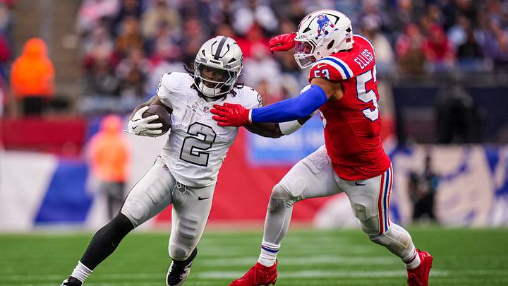 Oct 11, 2026; Foxborough, Massachusetts, USA; Las Vegas Raiders running back Ashton Jeanty (2) runs the ball against New England Patriots linebacker Christian Elliss (53) in the second half quarter at Gillette Stadium. Mandatory Credit: David Butler II-Imagn Images