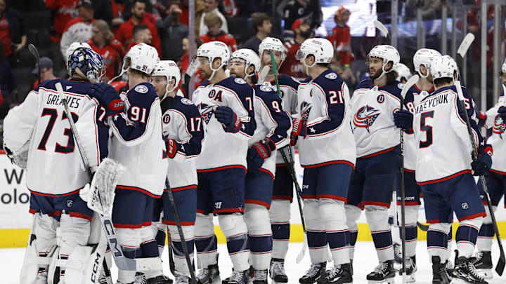 Apr 13, 2025; Washington, District of Columbia, USA; Columbus Blue Jackets goaltender Jet Greaves (73) celebrates with teammates after their game against the Washington Capitals at Capital One Arena. Mandatory Credit: Geoff Burke-Imagn Images
