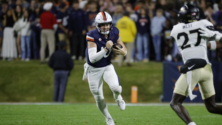 Nov 8, 2025; Charlottesville, Virginia, USA; Virginia Cavaliers quarterback Daniel Kaelin (10) runs with the ball against the Wake Forest Demon Deacons during the first half at Scott Stadium. Mandatory Credit: Amber Searls-Imagn Images Nov 8, 2025; Charlottesville, Virginia, USA; Virginia Cavaliers quarterback Daniel Kaelin (10) runs with the ball against the Wake Forest Demon Deacons during the first half at Scott Stadium. Mandatory Credit: Amber Searls-Imagn Images