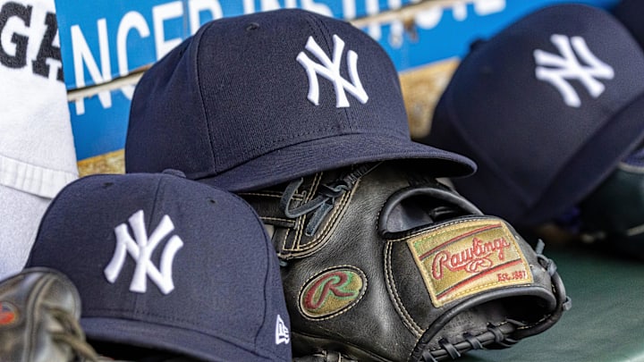 Apr 7, 2025; Detroit, Michigan, USA; New York Yankees baseball hats and gloves in the dugout out in the eighth inning against the Detroit Tigers at Comerica Park. Mandatory Credit: David Reginek-Imagn Images