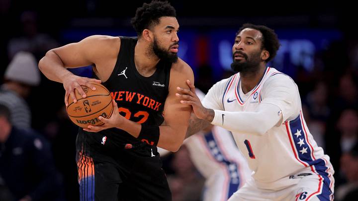 Dec 19, 2025; New York, New York, USA; New York Knicks center Karl-Anthony Towns (32) controls the ball against Philadelphia 76ers center Andre Drummond (1) during the third quarter at Madison Square Garden. Mandatory Credit: Brad Penner-Imagn Images