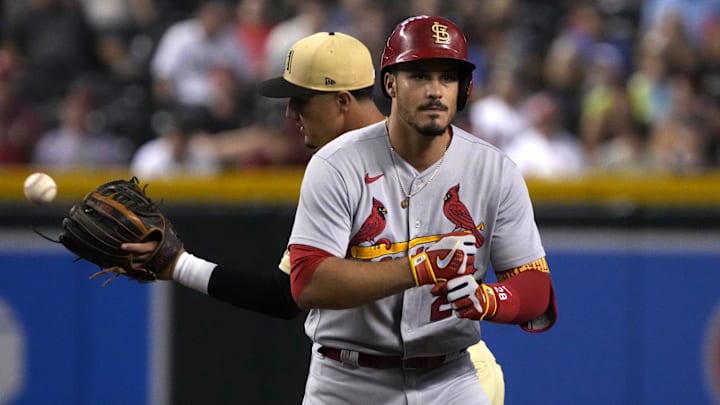 Aug 19, 2022; Phoenix, Arizona, USA; St. Louis Cardinals third baseman Nolan Arenado (28) reacts after hitting a double against the Arizona Diamondbacks in the first inning at Chase Field. Mandatory Credit: Rick Scuteri-Imagn Images