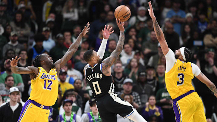 Mar 26, 2024; Milwaukee, Wisconsin, USA; Milwaukee Bucks guard Damian Lillard (0) puts up a shot in the first overtime against Los Angeles Lakers forward Taurean Prince (12) and Los Angeles Lakers forward Anthony Davis (3) at Fiserv Forum. Mandatory Credit: Michael McLoone-Imagn Images Mar 26, 2024; Milwaukee, Wisconsin, USA; Milwaukee Bucks guard Damian Lillard (0) puts up a shot in the first overtime against Los Angeles Lakers forward Taurean Prince (12) and Los Angeles Lakers forward Anthony Davis (3) at Fiserv Forum. Mandatory Credit: Michael McLoone-Imagn Images