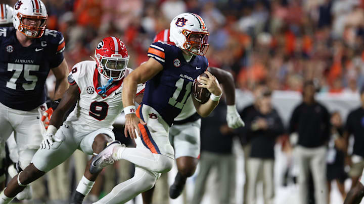 Oct 11, 2025; Auburn, Alabama, USA;  Auburn Tigers quarterback Jackson Arnold (11) carries during the second quarter against the Georgia Bulldogs at Jordan-Hare Stadium. Mandatory Credit: John Reed-Imagn Images