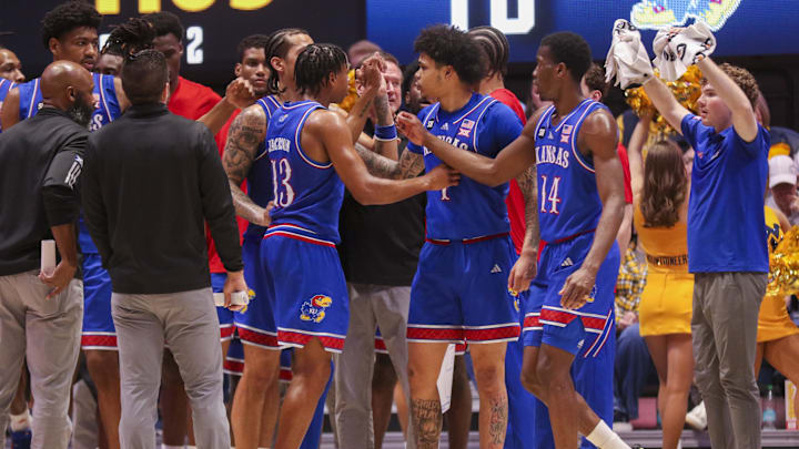 Jan 10, 2026; Morgantown, West Virginia, USA; Kansas Jayhawks players huddle during the second half against the West Virginia Mountaineers at Hope Coliseum. Mandatory Credit: Ben Queen-Imagn Images