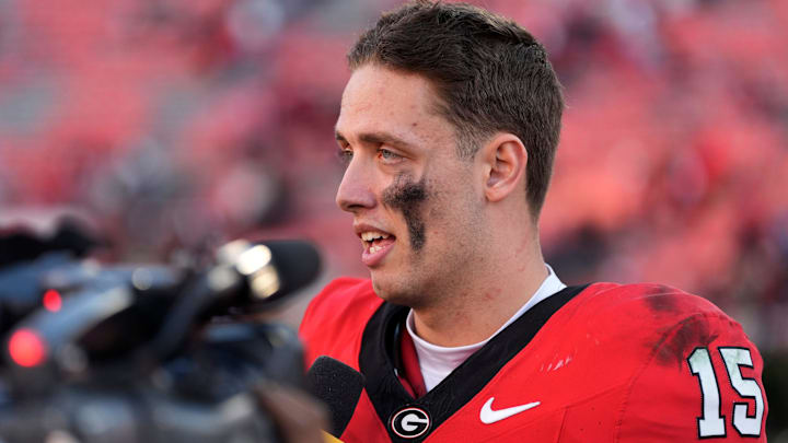 Then Georgia quarterback Carson Beck (15) speaks with the media after a NCAA college football game against Massachusetts in Athens, Ga., on Saturday, Nov. 23, 2024. Georgia won 59-21.