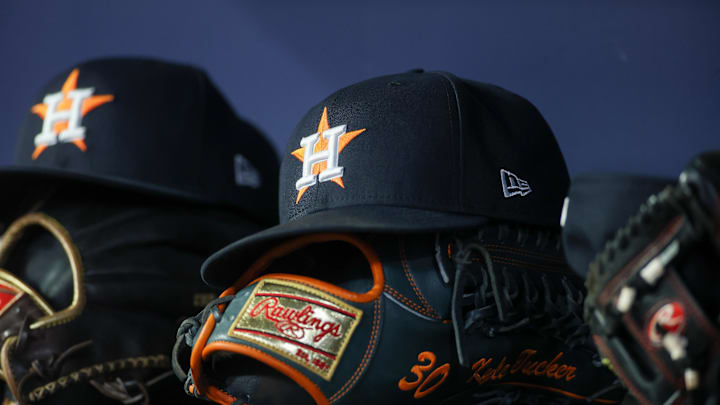 Apr 21, 2023; Atlanta, Georgia, USA; A detailed view of a Houston Astros hat and glove in the dugout against the Atlanta Braves in the fifth inning at Truist Park. Mandatory Credit: Brett Davis-Imagn Images Apr 21, 2023; Atlanta, Georgia, USA; A detailed view of a Houston Astros hat and glove in the dugout against the Atlanta Braves in the fifth inning at Truist Park. Mandatory Credit: Brett Davis-Imagn Images
