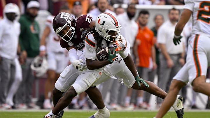 Texas A&M Aggies linebacker Daymion Sanford tackles Miami Hurricanes wide receiver Malachi Toney during the game between the Aggies and the Hurricanes at Kyle Field. Mandatory Credit: Jerome Miron-Imagn Images