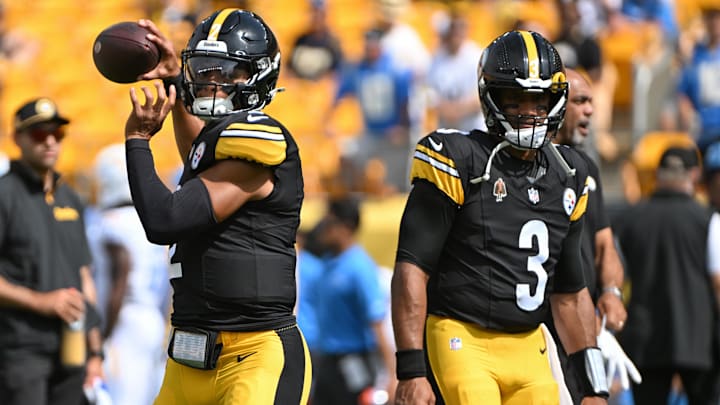 Sep 22, 2024; Pittsburgh, Pennsylvania, USA; Pittsburgh Steelers quarterback Justin Fields (2) warms up next to quarterback Russell Wilson (3) before a game against the Los Angeles Chargers at Acrisure Stadium. Mandatory Credit: Barry Reeger-Imagn Images