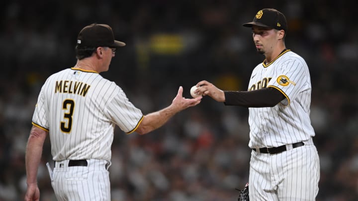Aug 8, 2022; San Diego, California, USA; San Diego Padres manager Bob Melvin (3) takes the ball from starting pitcher Blake Snell (right) during a pitching change in the sixth inning against the San Francisco Giants at Petco Park. Mandatory Credit: Orlando Ramirez-USA TODAY Sports