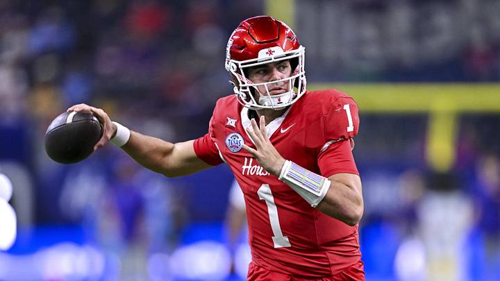 Dec 27, 2025; Houston, TX, USA; Houston Cougars quarterback Conner Weigman (1) warms up prior to the game against the Louisiana State Tigers at NRG Stadium. Mandatory Credit: Maria Lysaker-Imagn Images 