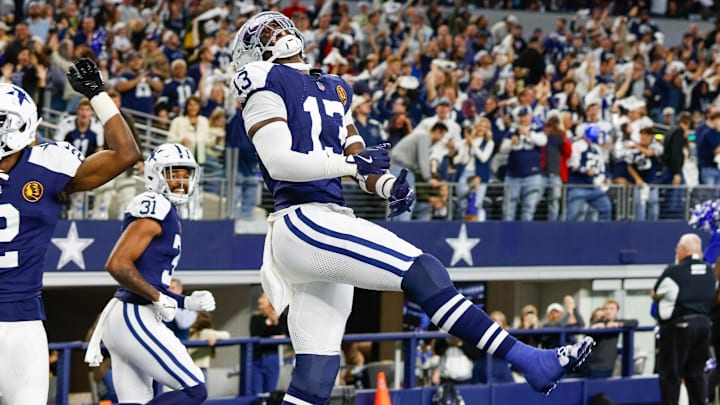 Dallas Cowboys linebacker DeMarvion Overshown celebrates his interception touchdown return