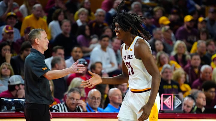 ASU head coach Bobby Hurley high-fives center Jayden Quaintance (21) as he comes to the bench during a game at Desert Financial Arena in Tempe on Jan. 25, 2025.