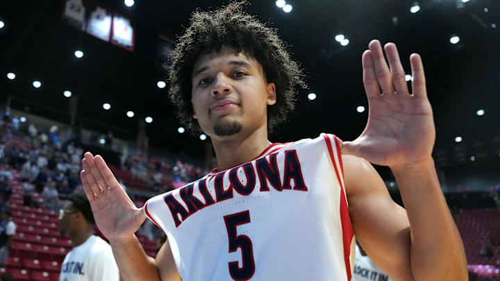 Arizona Wildcats guard Brayden Burries celebrates after defeating the Utah State Aggies.