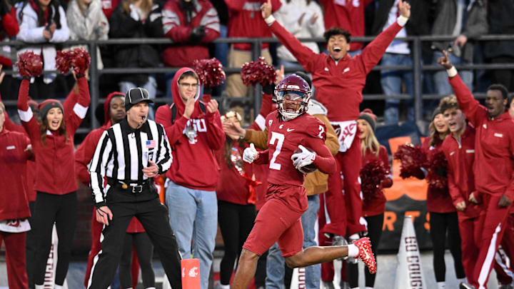 Nov 30, 2024; Pullman, Washington, USA;  Washington State Cougars wide receiver Kyle Williams (2) scores a touchdown against the Wyoming Cowboysin the first half at Gesa Field at Martin Stadium. Mandatory Credit: James Snook-Imagn Images